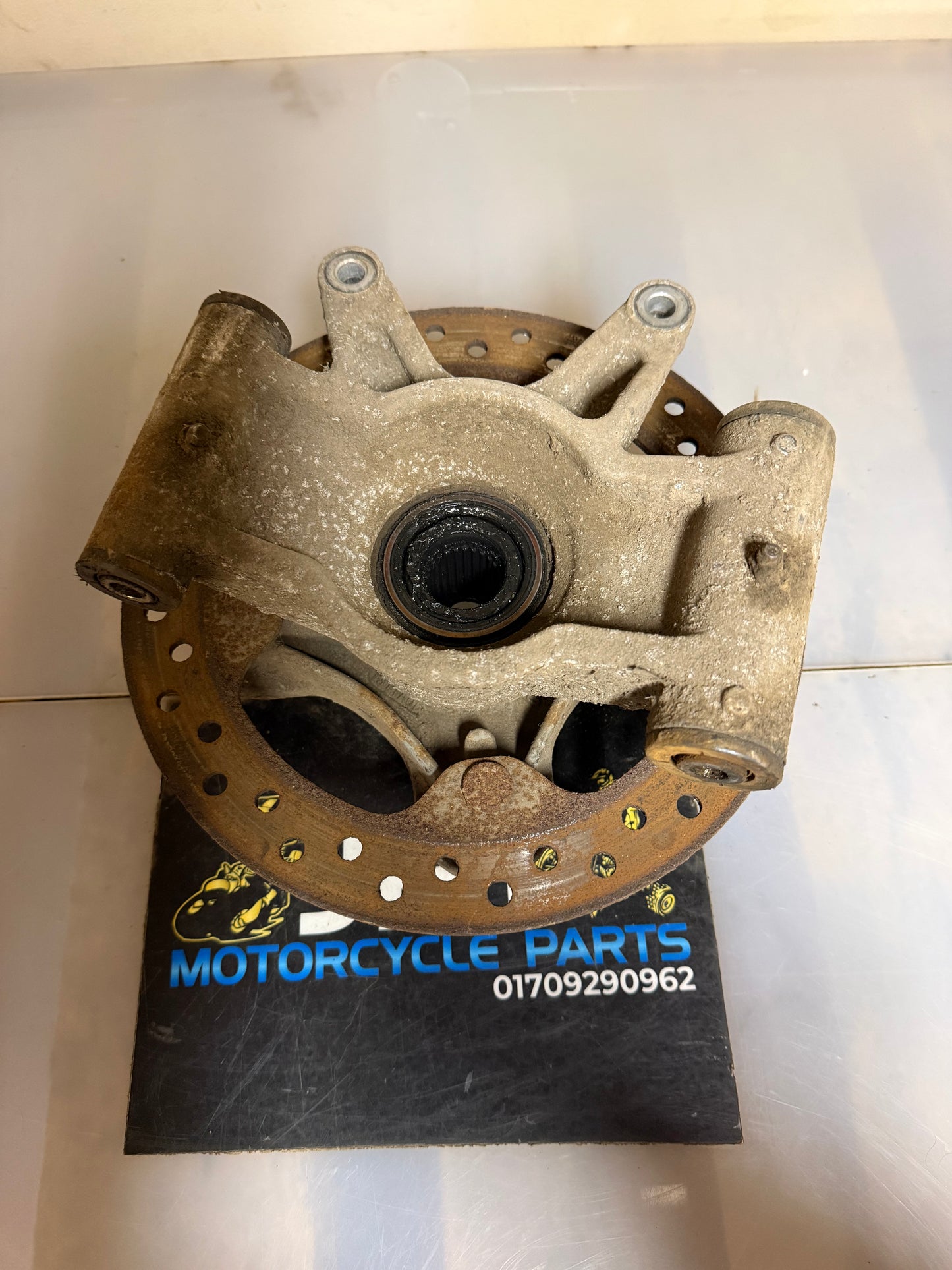 Polaris scrambler front left hub