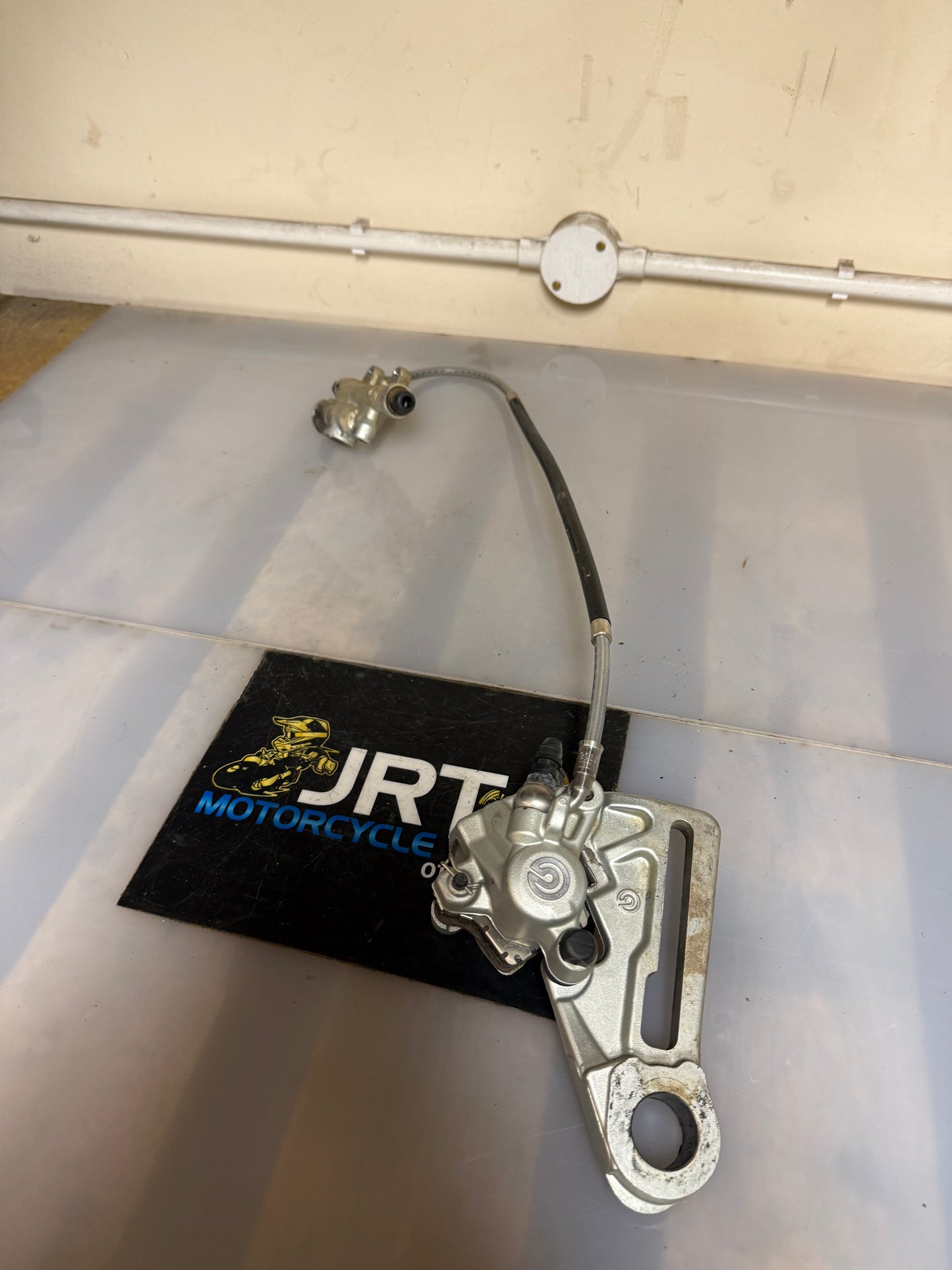 KTM SXF 350 2017 rear brake calliper with mounting bracket and hydronic line