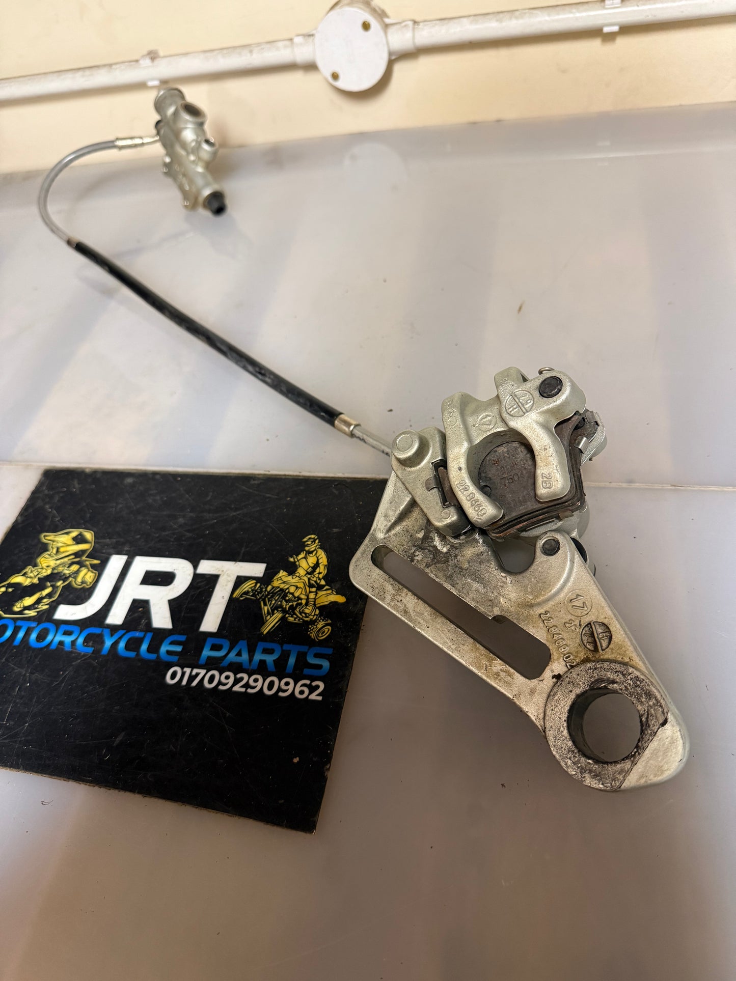 KTM SXF 350 2017 rear brake calliper with mounting bracket and hydronic line